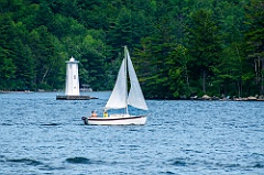 Sailing Past Herrick Cove Light on Lake Sunapee